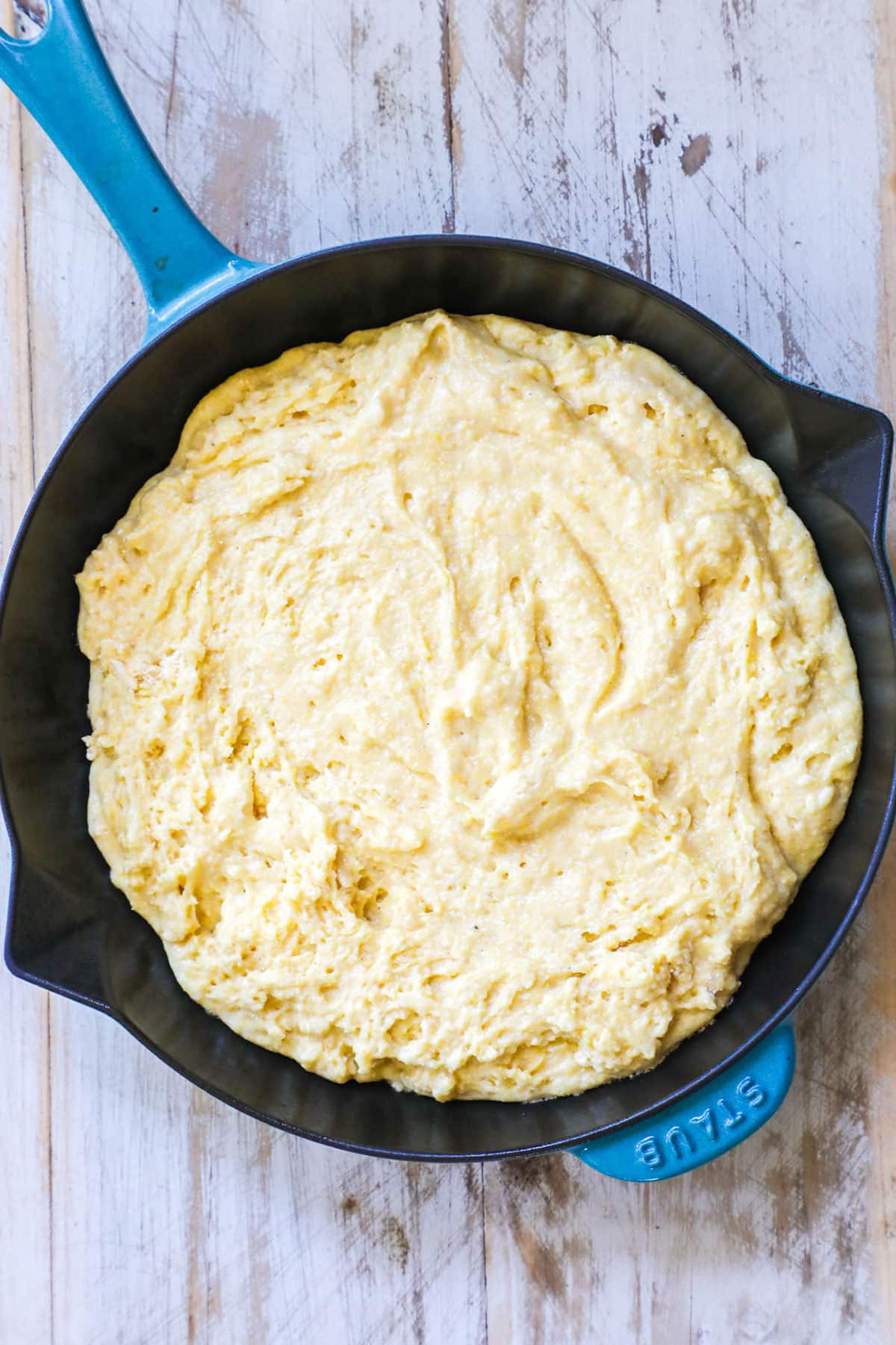 Buttermilk Cornbread Step 4: Place the batter in the hot cast iron skillet and return to the oven to bake for 18-28 minutes, or until just set in the center.