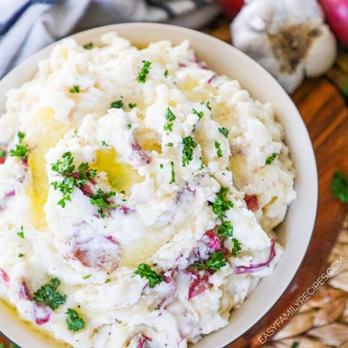 Homemade Garlic Mashed Potatoes with butter on top in a bowl