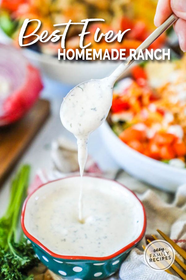 Spooning out Homemade Ranch Dressing from a bowl