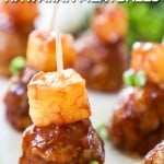 Hawaiian BBQ Meatballs on a toothpick with pineapple.