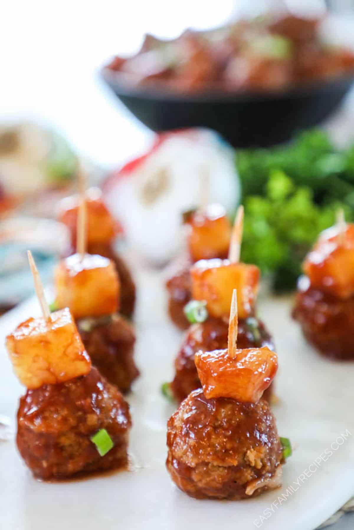 Hawaiian Meatballs and pineapple on a toothpick prepared as an appetizer