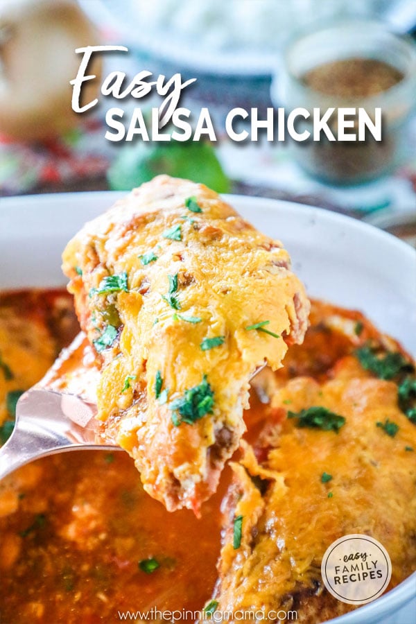 Easy Salsa Chicken being lifted out of the casserole dish