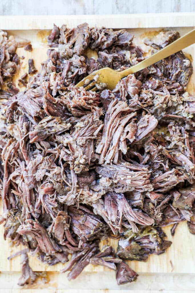How to make Mexican Beef in crockpot step 3: remove the roast from the crockpot and shred it.