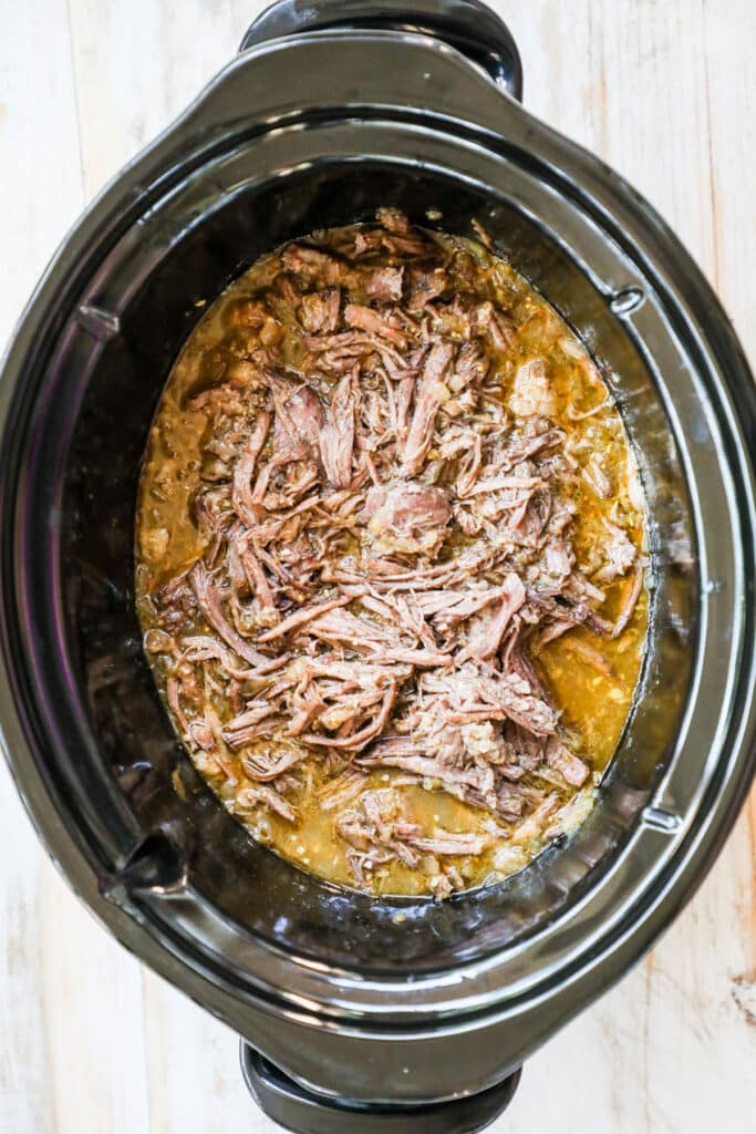 How to make Mexican Beef in crockpot step 4: return the shredded beef to the crockpot and mix into the juices.