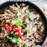 Shredded Mexican beef in a bowl with text overlay.