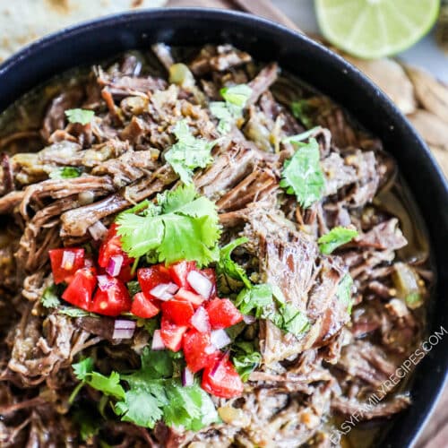 Easy Slow Cooker Mexican Beef ready to serve with tortillas.
