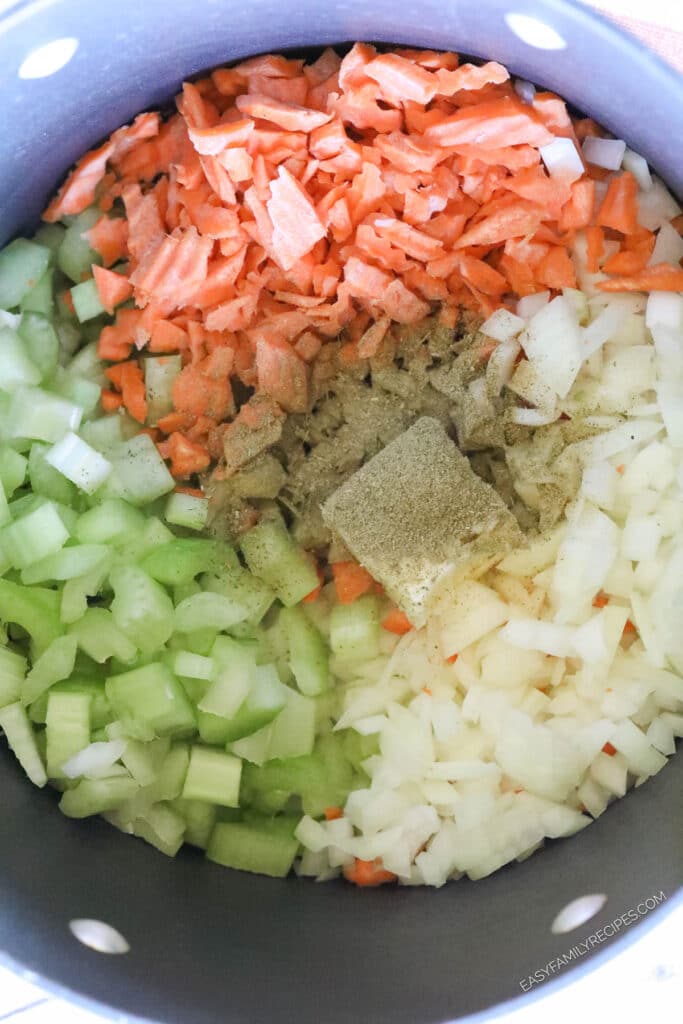 How to makechicken noodle soup with rotisserie chicken step 1: Saute carrots, celery, onions, with butter and seasoning.