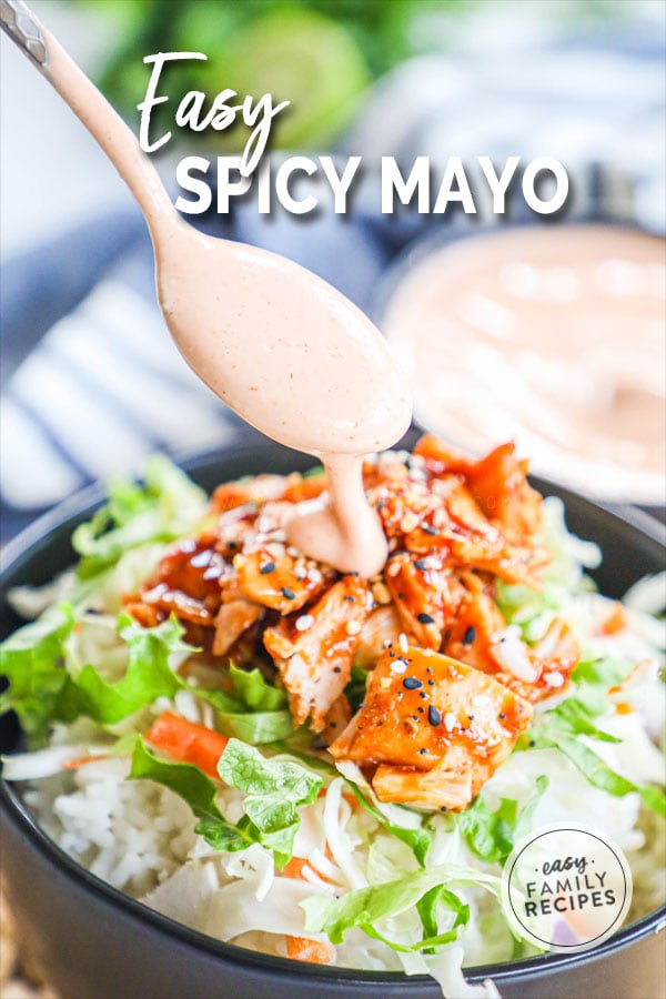 Spicy Mayo being drizzled over asian chicken and rice
