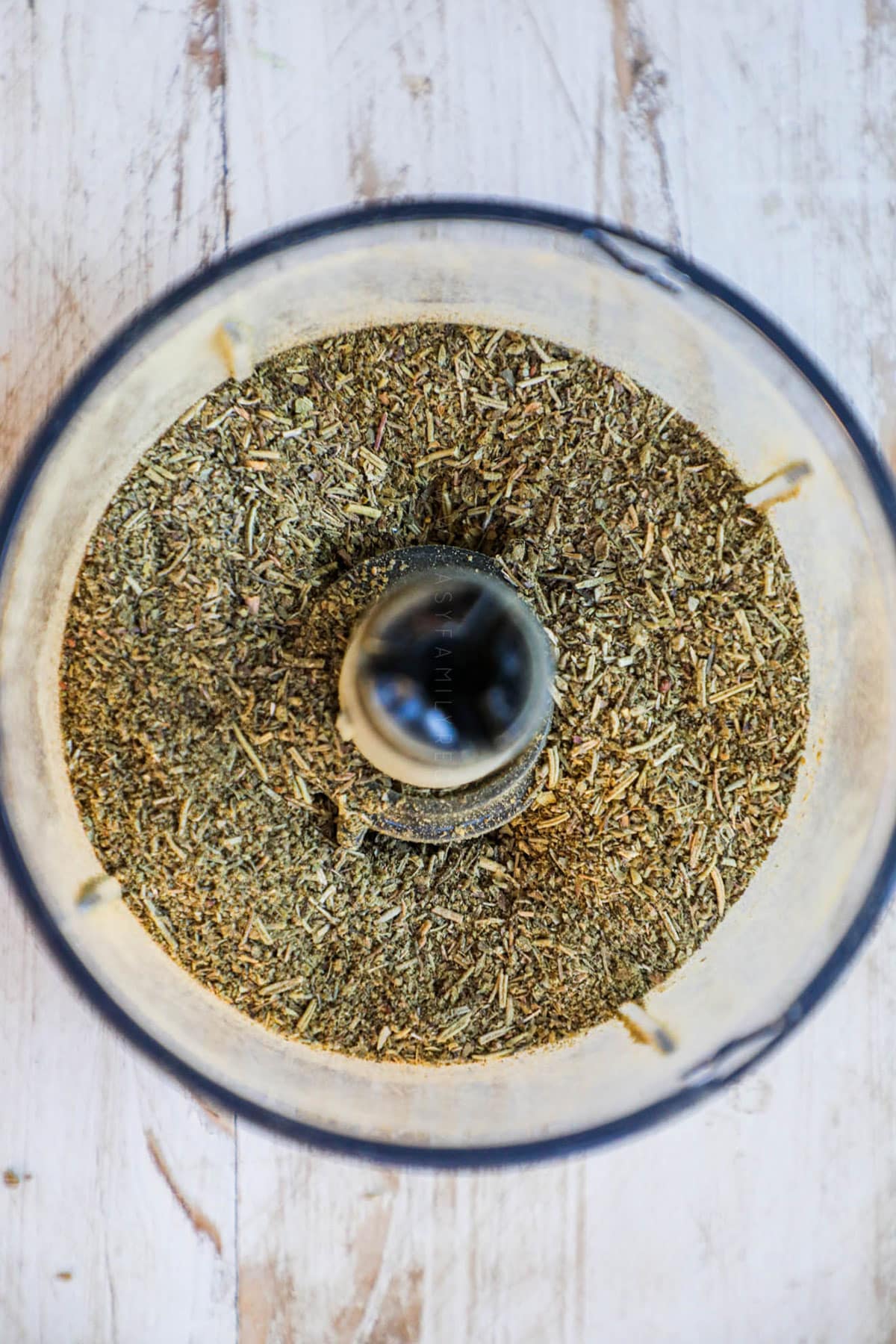 A food processor of freshly blended Italian seasonings