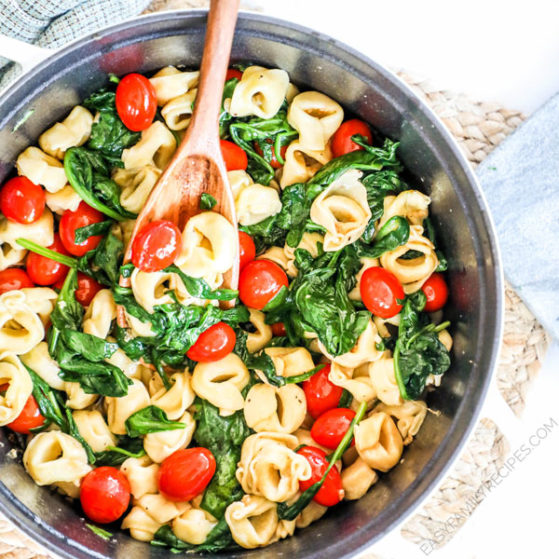 Tortellini with spinach and tomatoes in Brown Butter sauce in a pot