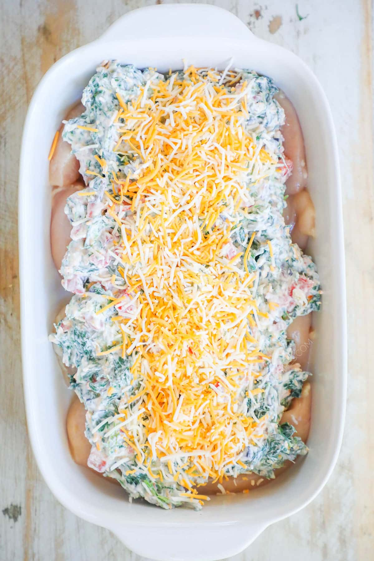 Step 3: spread the spinach mixture on top of the chicken. Top with remaining colby jack cheese