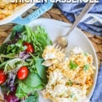 A plateful of poppy seed chicken and a green side salad next to it.