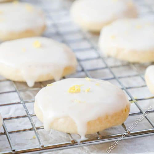 Lemon Meltaway Cookies with glaze on a cooling rack