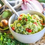 Fresh Guacamole served in a bowl with a spoon