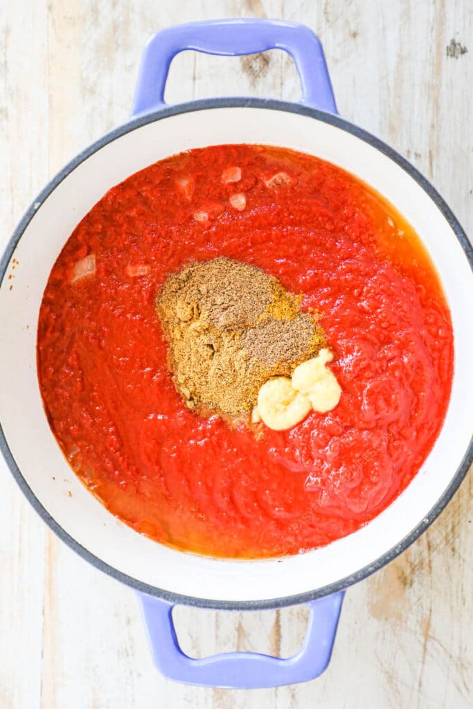 How to make butter chicken step 2: Add spices and mix.