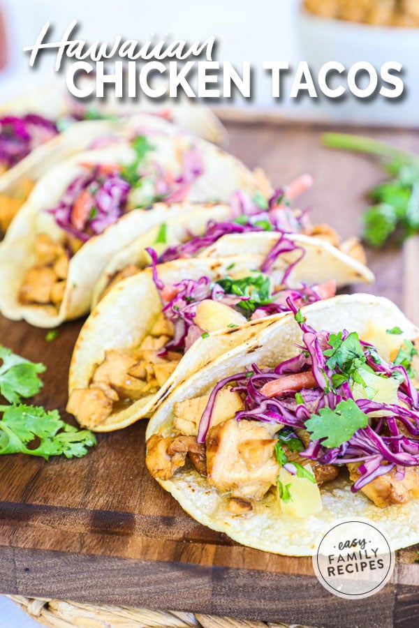 Grilled Hawaiian Chicken Tacos topped with pineapple coleslaw and garnished with cilantro