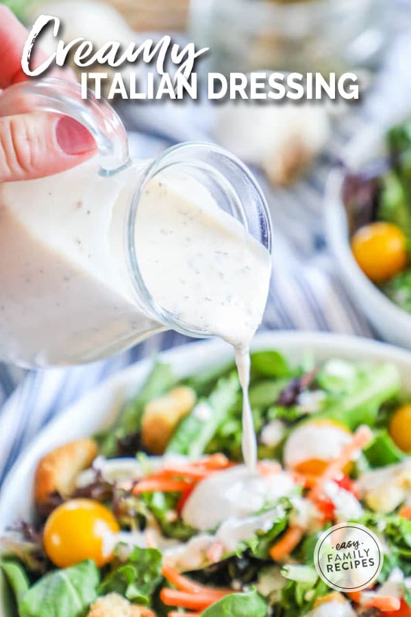 Salad being topped with Creamy Italian Dressing