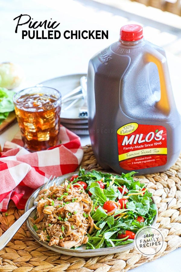 Picnic Pulled BBQ Chicken on a plate with salad next to a jug of sweet tea