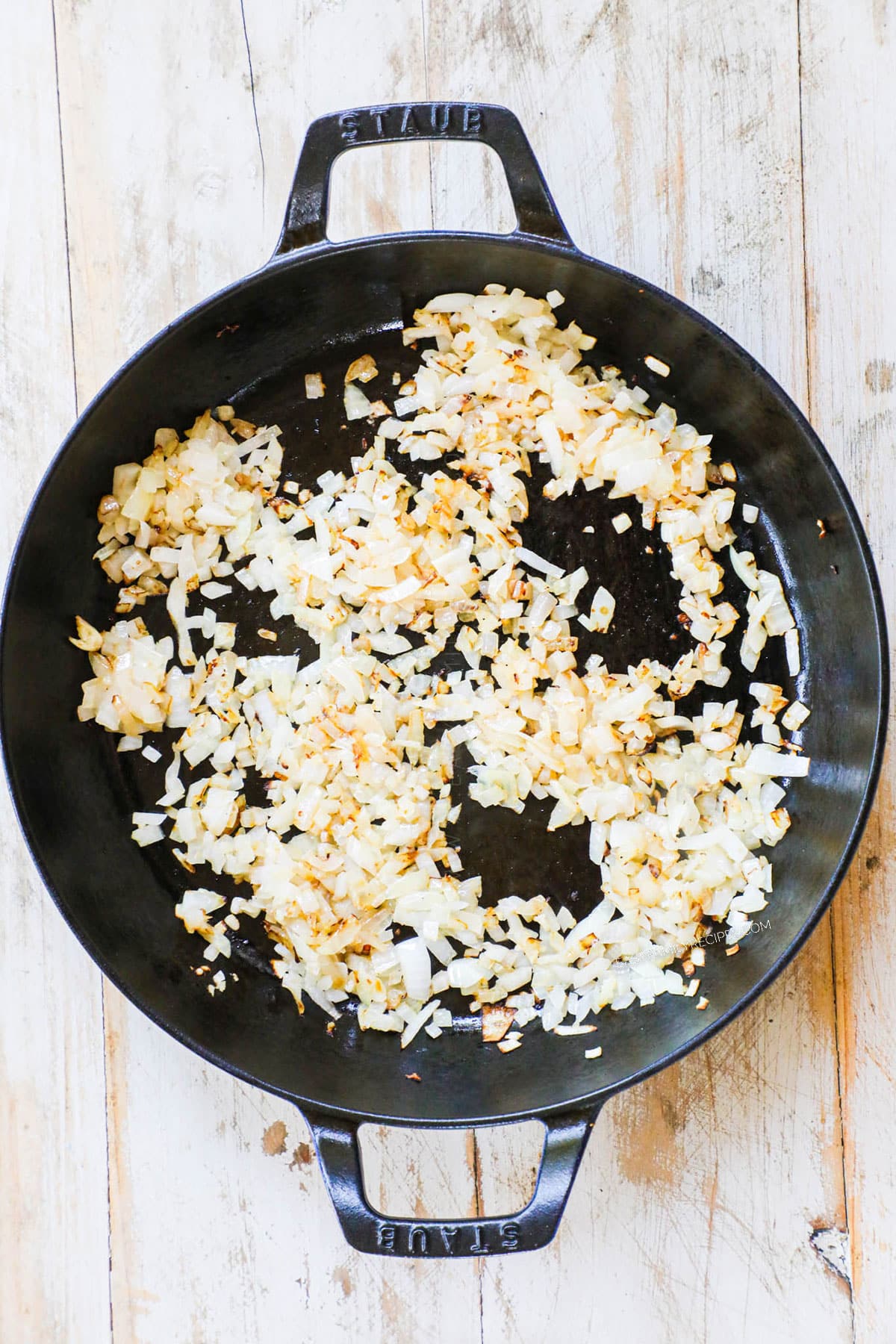 Step 1 to make chicken fried rice - add butter, onion and cook until slightly browned