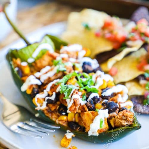 Baked Stuffed Poblano Pepper on a plate with chips