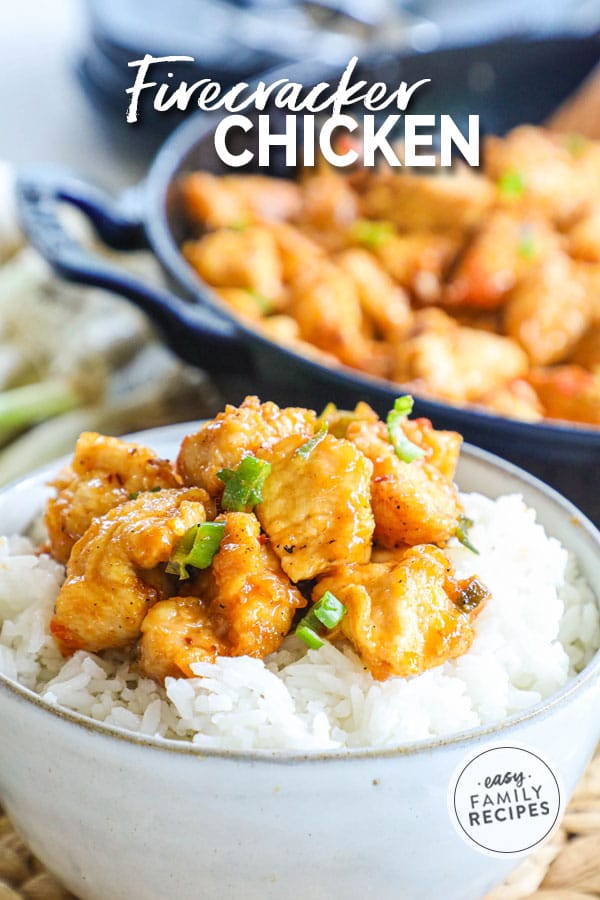 Firecracker chicken in a bowl over rice