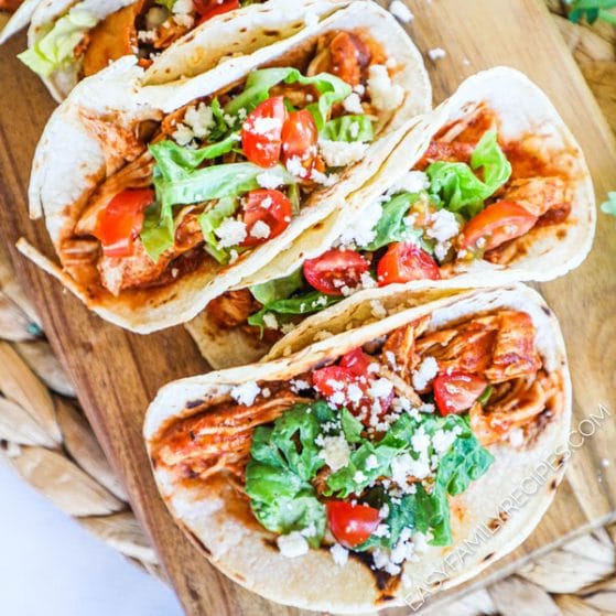 Crock pot Chicken tinga tacos served on a board