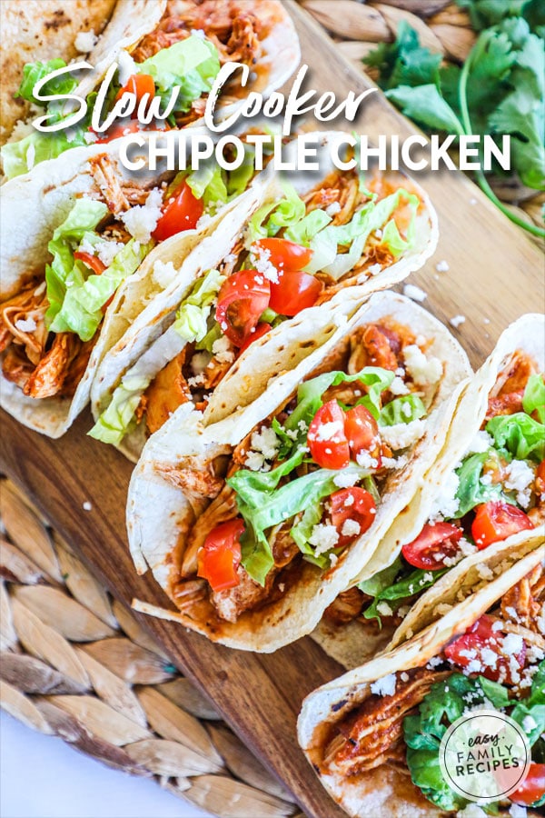 Chicken Tinga Tacos topped with lettuce and pico de gallo