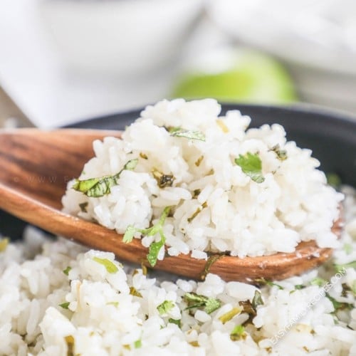 Cilantro lime rice just like Chipotle being scooped out of the pot
