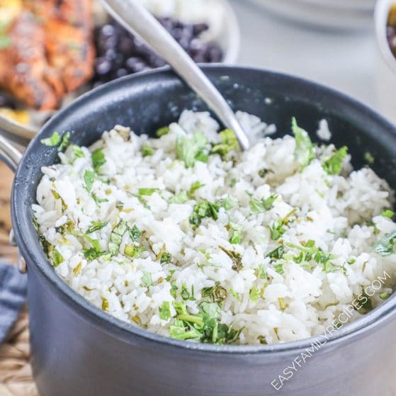 Cilantro Lime White Rice made in a pot being stirred with a spoon