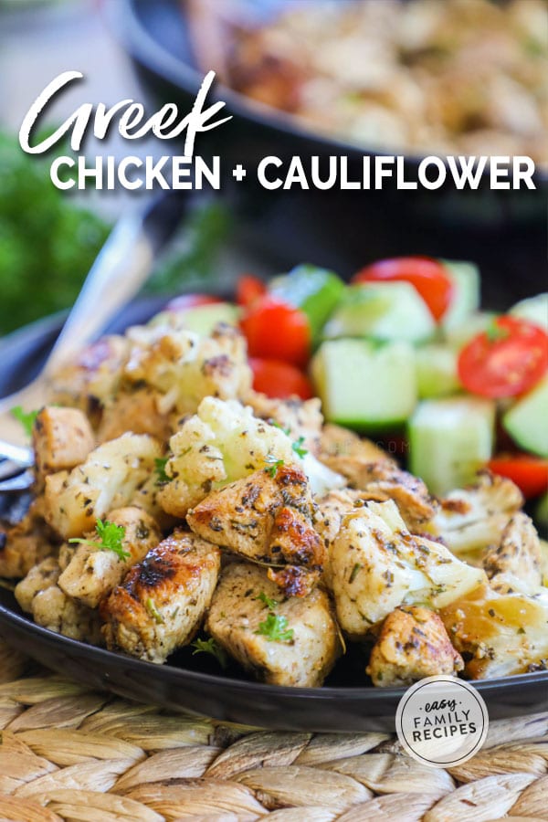 Greek Chicken and Cauliflower served with cucumber and tomato on a plate