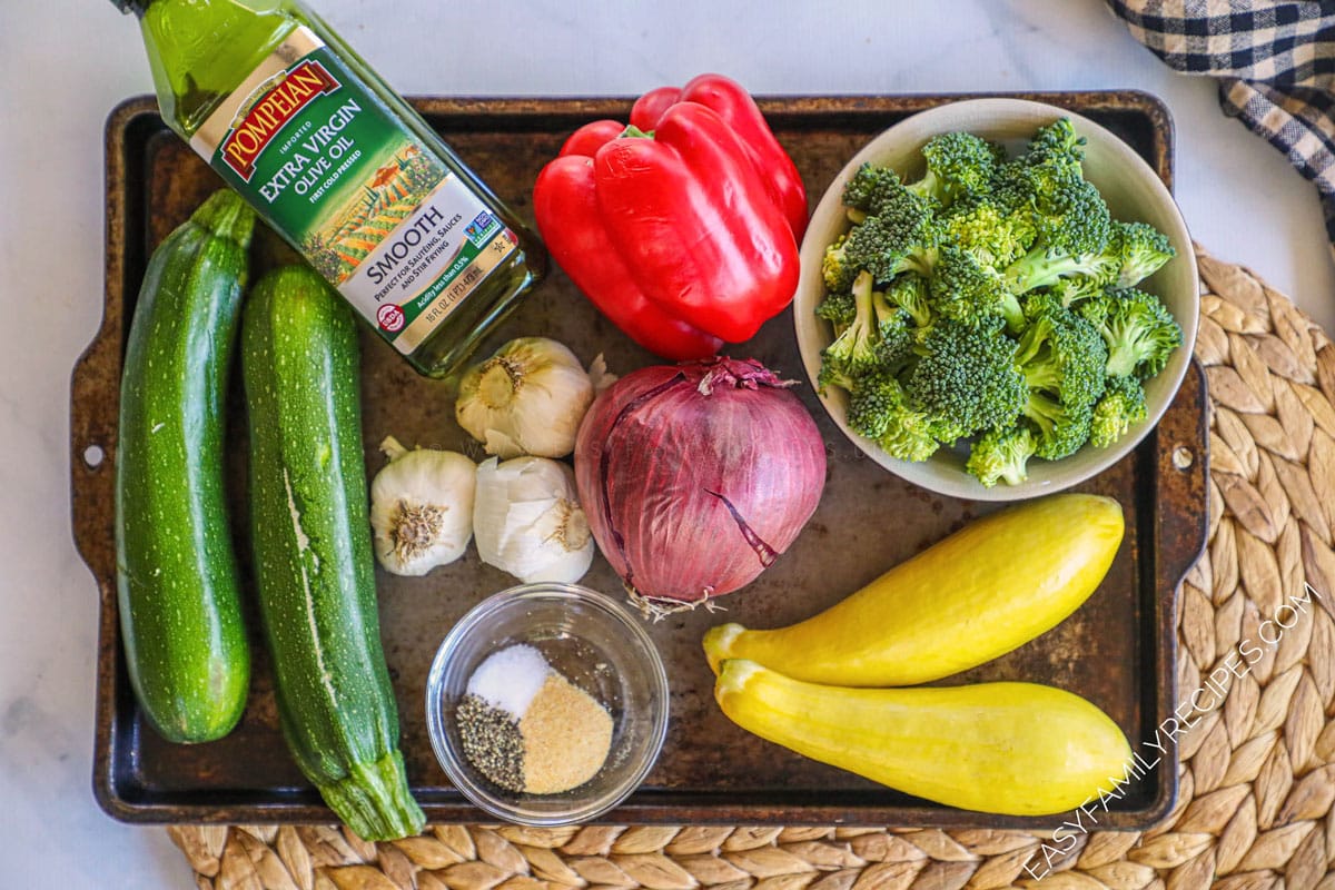 INgredients for garlic roasted veggies. Peppers, broccoli, squash, garlic, olive oil, onion and seasonings