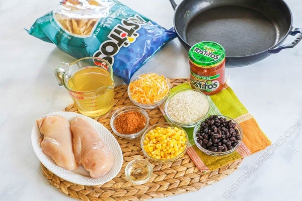 Ingredients to make chicken burrito bowl in skillet