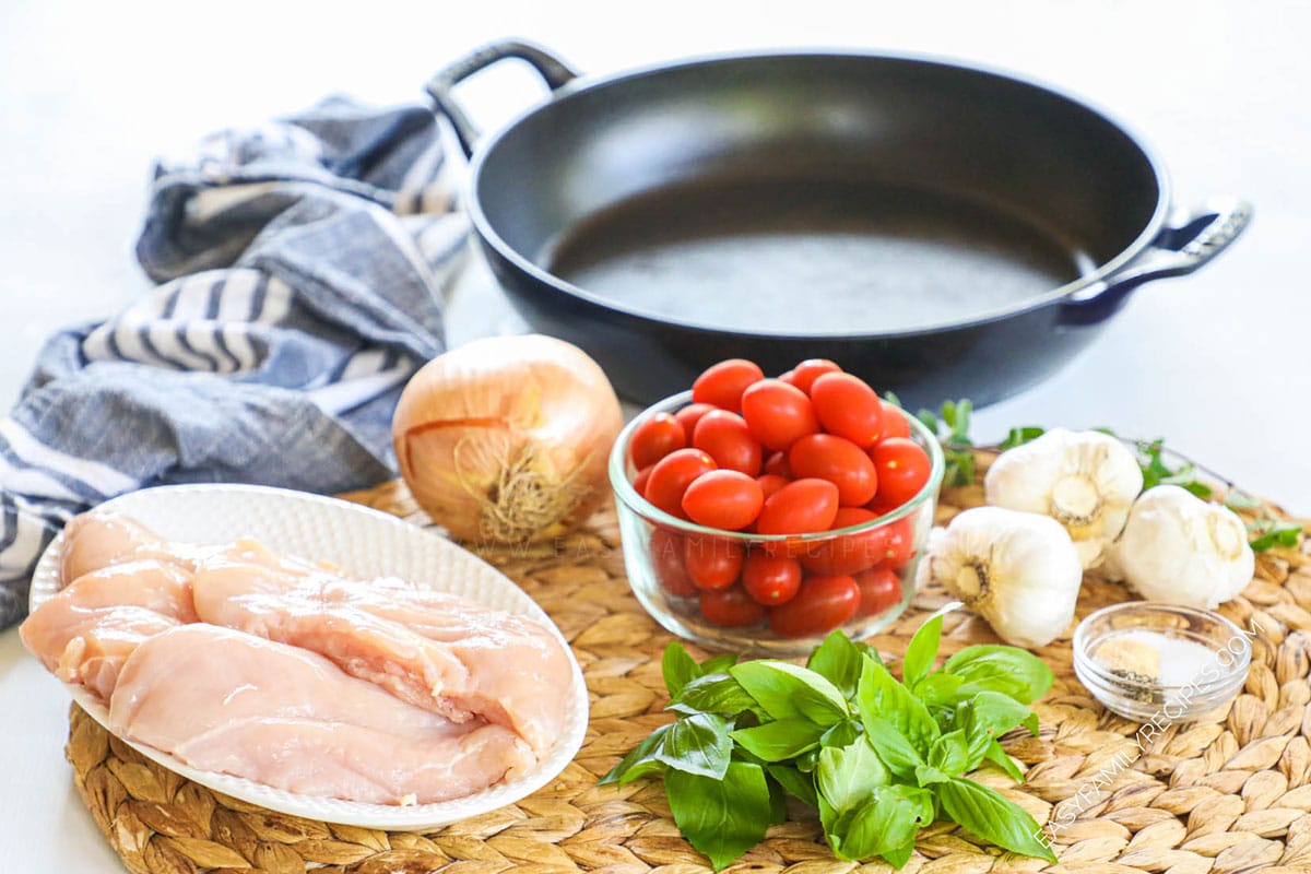 Ingredients for Chicken Pomodoro including chicken breast, tomatoes, basil, onion, and garlic