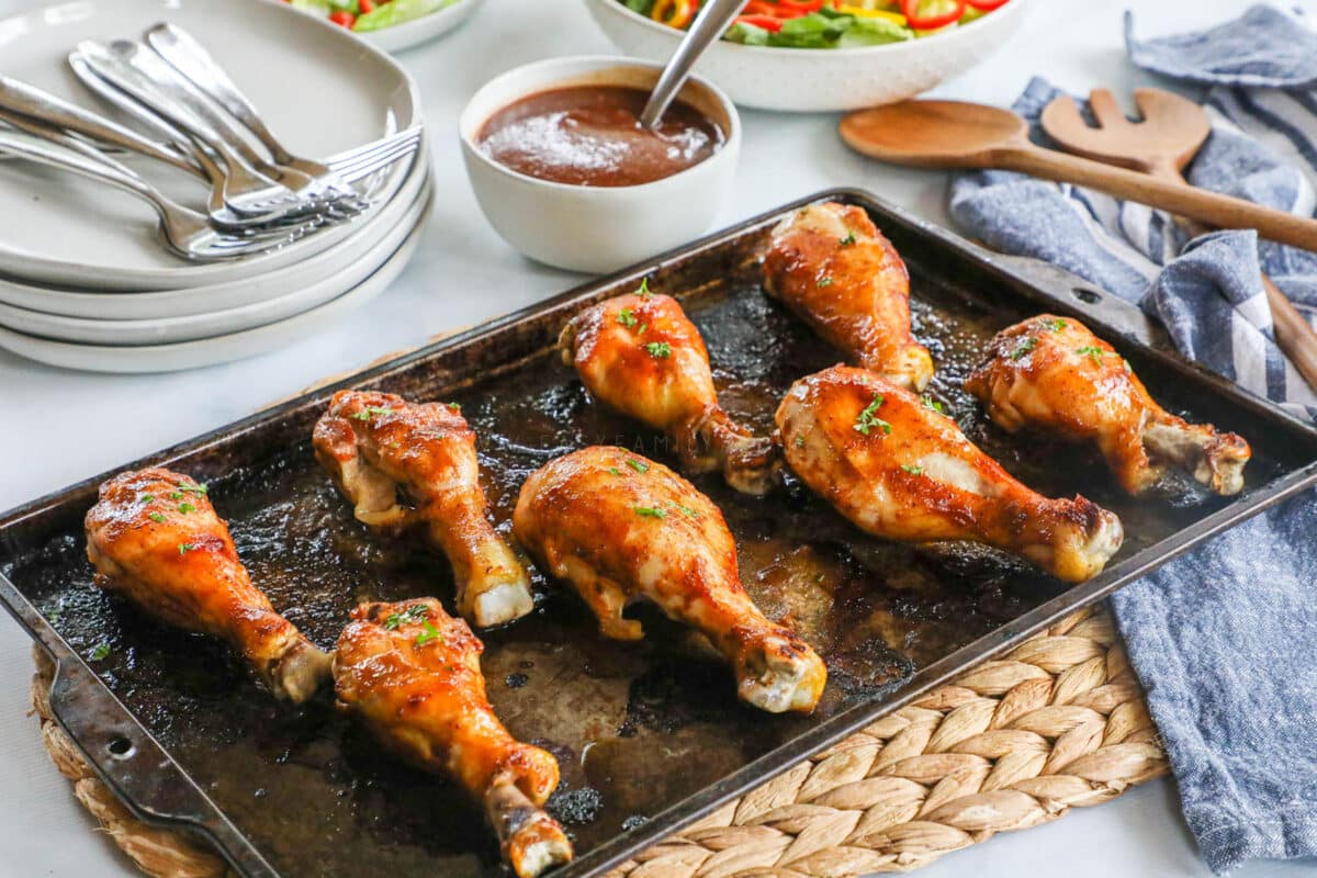 Baked Chicken drumsticks glazed with BBQ sauce straight out of the oven.