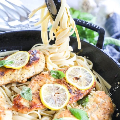 Lifting lemon basil pasta to serve this hearty pasta dinner