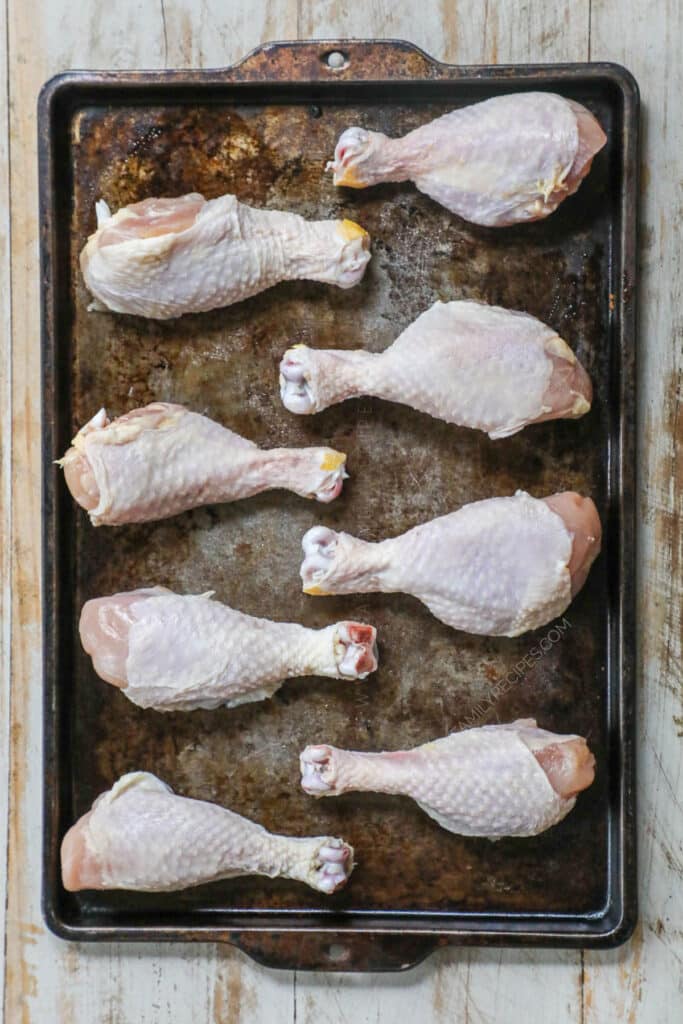 How to make Baked BBQ Chicken Drumsticks Step 1: Arrange drumsticks on a baking sheet.