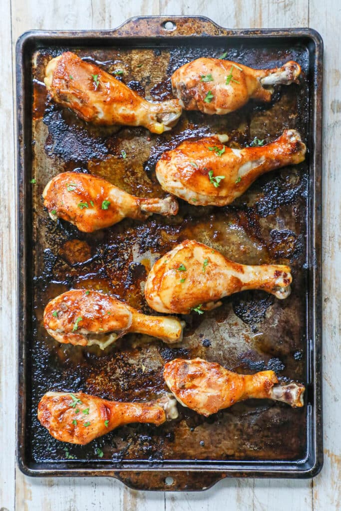 How to make Baked BBQ Chicken Drumsticks Step 4: Bake until crispy, then remove from oven and glaze with additional BBQ Sauce.
