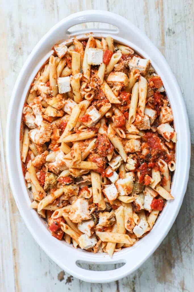 How to make chicken parmesan casserole recipe step 3: Mix the casserole ingredients together and top with cheese.