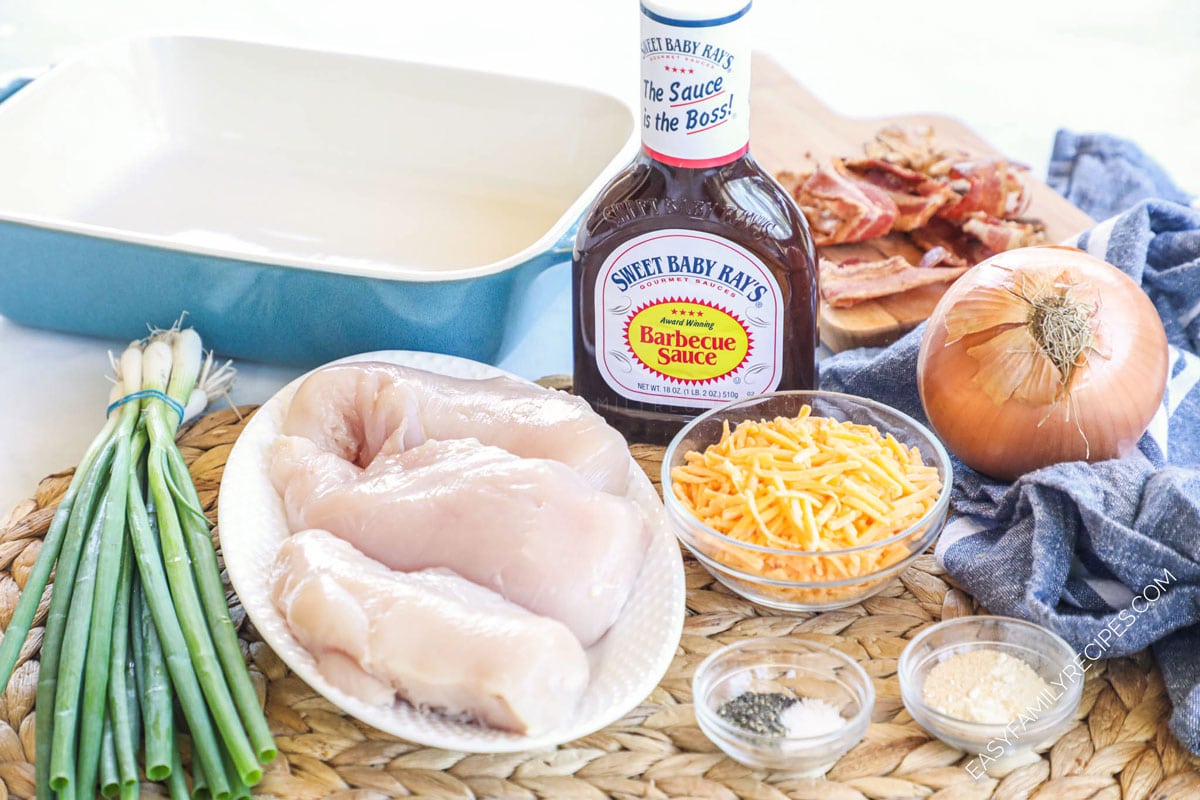 Ingredients for Chhsy Bacon BBQ Chicken Recipe - Chicken Breast, Sweet Baby Rays BBQ Sauce, onion, cheese, seasonings, green onions, crispy bacon