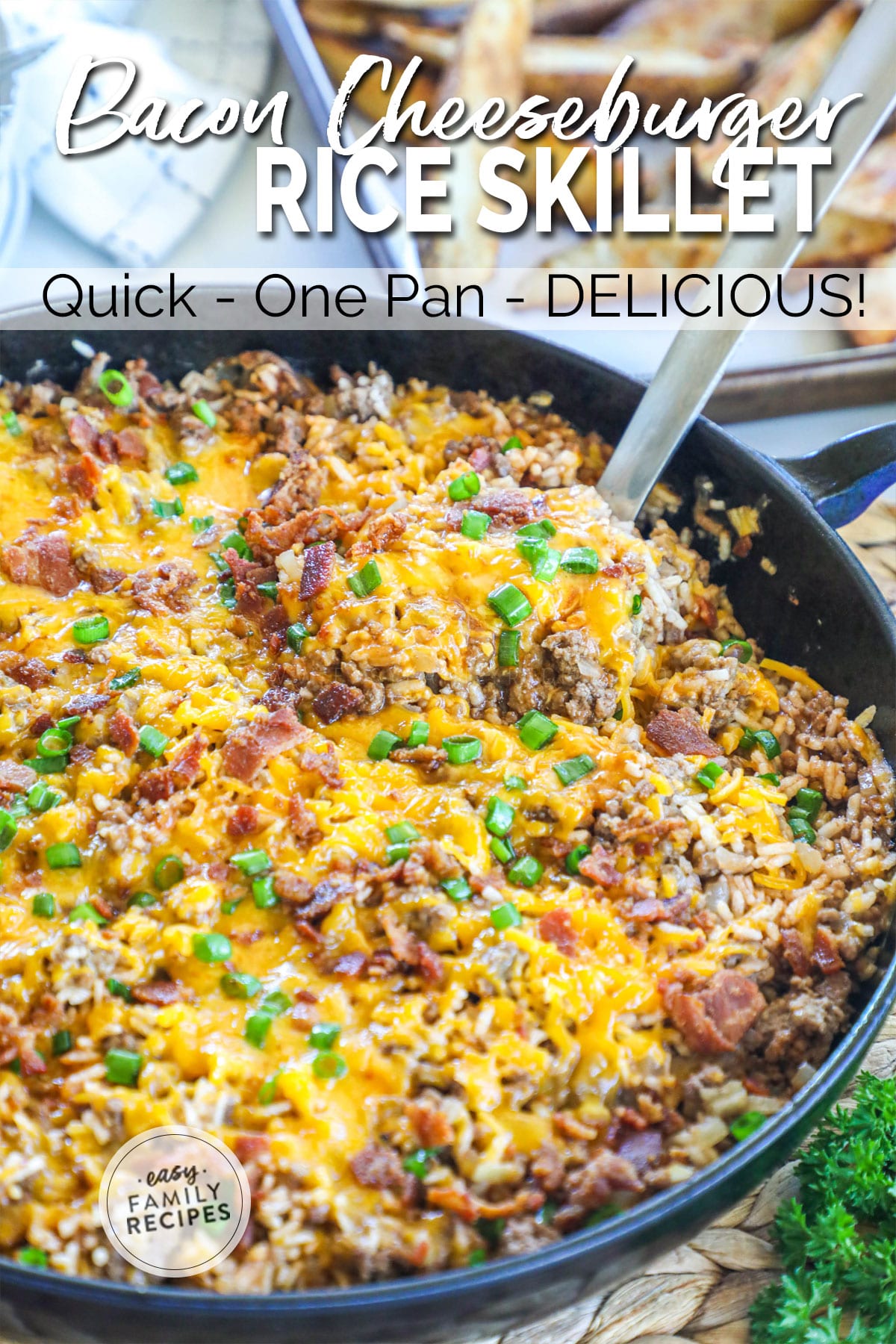 Cheeseburger Rice Casserole in a Skillet Garnished with Bacon and green onion