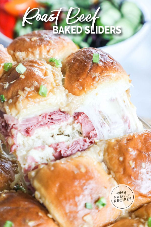 Cheese pulling as baked Roast Beef Sliders are lifted from the pan
