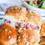 Roast Beef Sliders being lifted from a pan with a spatula