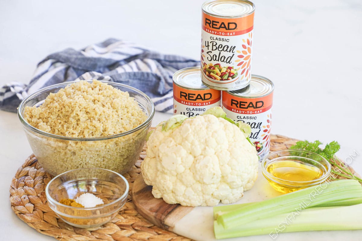 Ingredients for Chilled Curried Quinoa Salad including Quinoa, cauliflower, celery, spices, 4 bean salad, and oil.