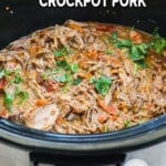 Thai pork in crockpot garnished with cilantro.