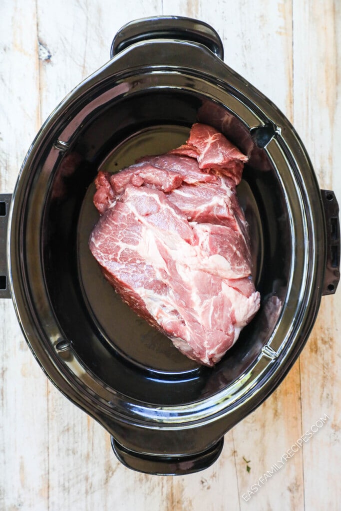 How to make thai pork in crockpot step 1: place pork shoulder in slow cooker.
