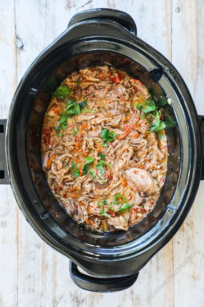 How to make thai pork in crockpot step 4: shred the pork and stir in peanut butter.