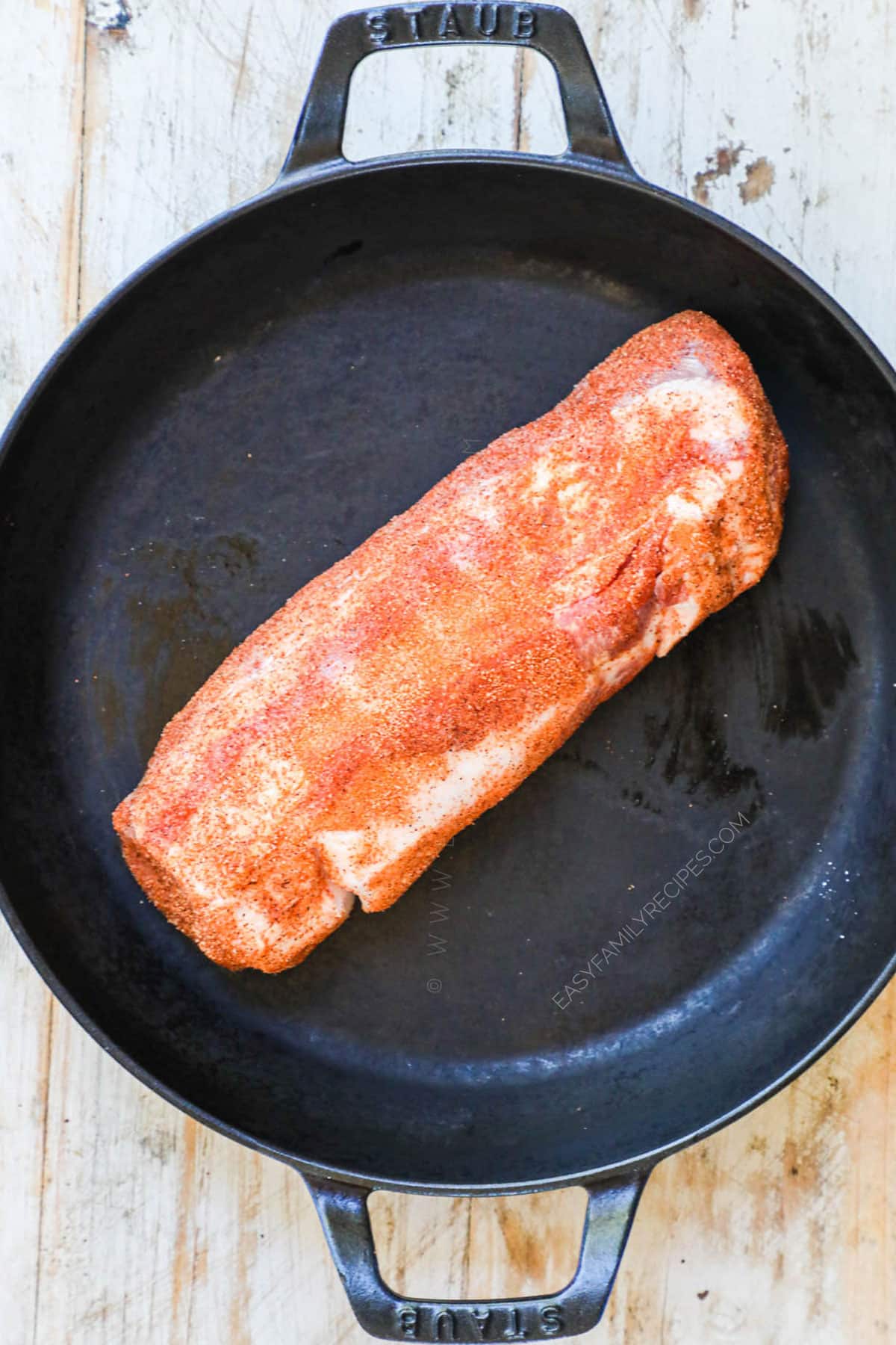 step 1: Season the pork tenderloin on all sides with cajun seasoning.
