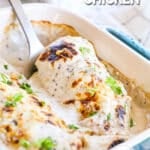 Spatula lifting cream of mushroom chicken breast out of the casserole dish.