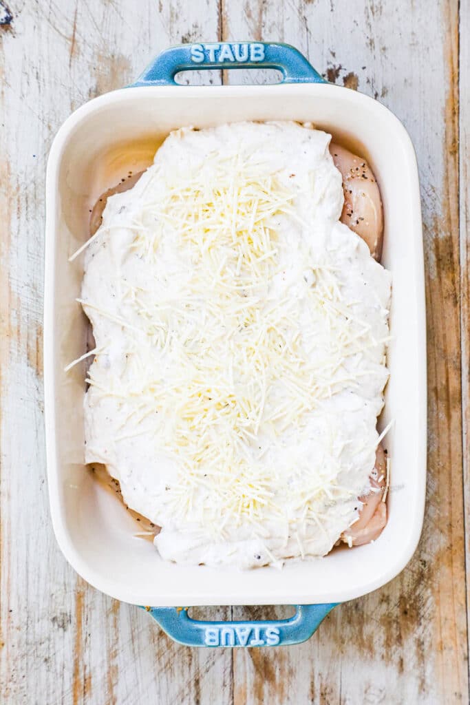 How to make cream of mushroom chicken casserole step 3: Spread the cream of mushroom soup mixture over the chicken breast and top with cheese.