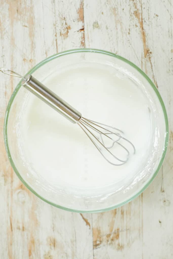 How to make key lime cookies step 3: Prepare the glaze by whisking together powdered sugar and lime juice.